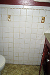 Old tile, linoleum and toilet - before