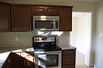 New cabinets, countertops, tile backsplash and appliances